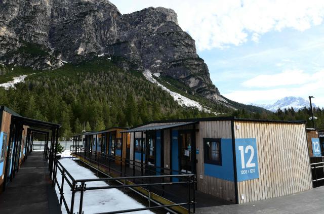 A picture shows a part of the Cortina Athletes Village built by Simico, the company in charge of the infrastructure works for the temporary complex of modular mobile homes ahead of Milano Cortina 2026 Olympic Games, in Fiames, near Cortina d'Ampezzo, on December 11, 2025. (Photo by Stefano RELLANDINI / AFP)