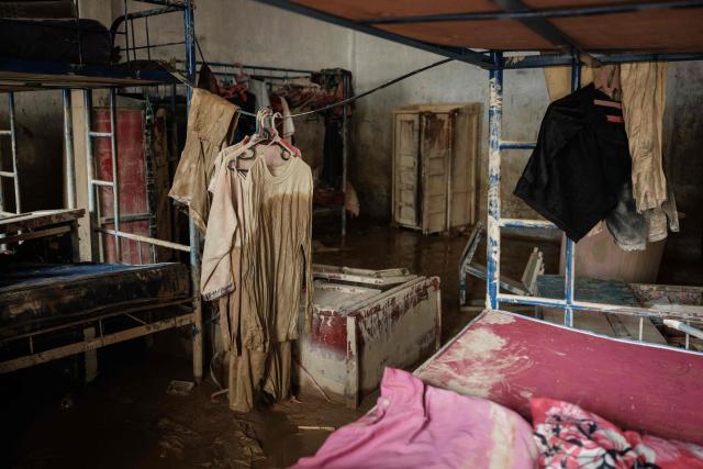 Students' belongings, once submerged by a flash flood about three weeks ago, remain at Darul Mukhlisin Islamic Boarding School and its attached mosque in Aceh Tamiang, Northern Sumatra, on December 14, 2025. Devastating floods and landslides have killed 1,006 people in Indonesia, rescuers said on December 13 as the Southeast Asian nation grapples with the huge scale of relief efforts. (Photo by Yasuyoshi CHIBA / AFP)