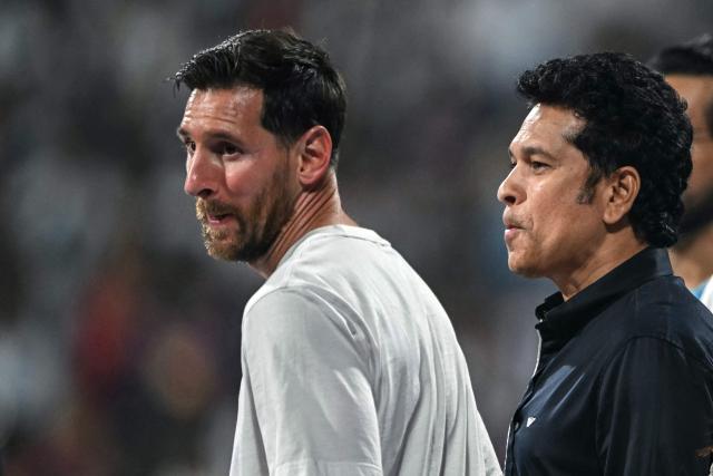 Argentina's footballer Lionel Messi (L) and India's former cricketer Sachin Tendulkar attend an event during Messi's GOAT Tour at the Wankhede Stadium in Mumbai on December 14, 2025. (Photo by Indranil MUKHERJEE / AFP)