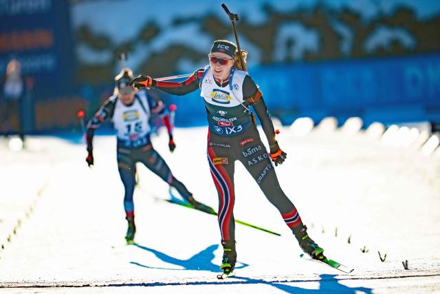 3rd placed Norway's Maren Kirkeeide crosses the finishing line in the women's 10km pursuit event of the IBU Biathlon World Cup in Hochfilzen, Austria on December 14, 2025. (Photo by GEORG HOCHMUTH / APA / AFP) / Austria OUT