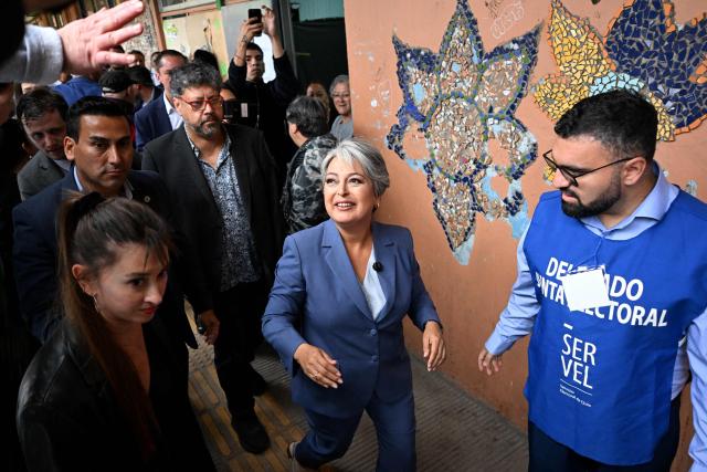 Chile's presidential candidate Jeannette Jara, of the Unidad por Chile coalition, arrives at a polling station during the presidential runoff election in Santiago on December 14, 2025. Chileans head to the polls for a presidential runoff between Jeannette Jara, a communist backed by a broad left coalition, and Jose Antonio Kast, a devout far-right politico promising a hard line on security and migration. (Photo by Eitan ABRAMOVICH / AFP)