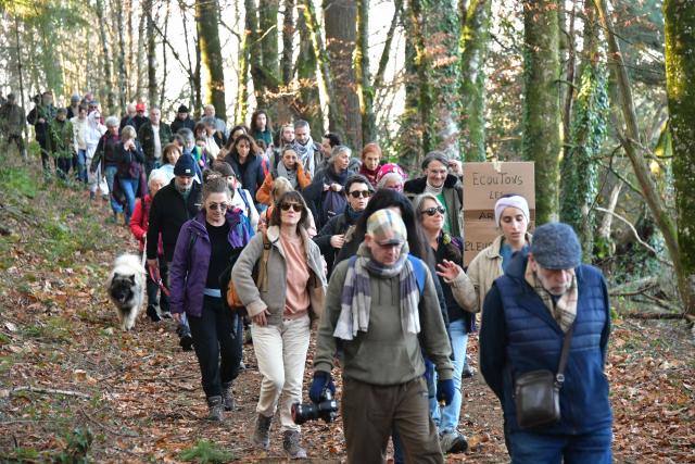 Protestors take part in a march organised by "collectif Alouettes 147" against the project of a new road (2x2 between Couzeix and Nieul), in Nieul, central France on December 14, 2025. (Photo by PASCAL LACHENAUD / AFP)