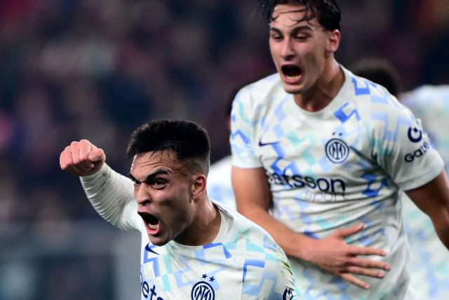 Inter Milan’s Argentine forward #10 Lautaro Martнnez (L) celebrates after scoring a goal during the Italian Serie A football match between Genoa and Inter Milan at Luigi Ferraris Stadium in Genoa on December 14, 2025. (Photo by MARCO BERTORELLO / AFP)