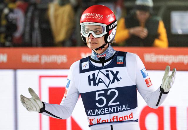 Austria's Manuel Fettner reacts after competing in the men's Individual Large Hill HS140 of the FIS Ski Jumping World Cup in Klingenthal, eastern Germany on December 14, 2025 (Photo by JENS SCHLUETER / AFP)