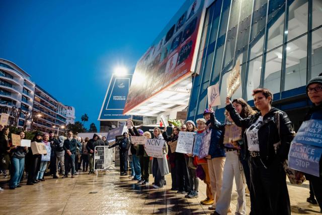 Protesters demonstrate at the call of French feminist collective "Nous Toutes" (All of Us) in front of the Claude-Debussy theatre in Cannes, just minutes before the start of Ary Abittan's show in Cannes, south France, on  December 14, 2025. Ary Abittan was accused of rape in late 2021 by a young woman he had been dating for several weeks. After three years of investigation, the case was dismissed and the decision was upheld on appeal in January. However, his return to the stage has since been contested by feminists who regularly protest outside the venues where he performs. (Photo by Frederic DIDES / AFP)
