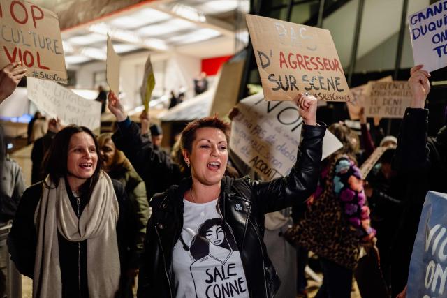 Protesters demonstrate at the call of French feminist collective "Nous Toutes" (All of Us) in front of the Claude-Debussy theatre in Cannes, just minutes before the start of Ary Abittan's show in Cannes, south France, on  December 14, 2025. Ary Abittan was accused of rape in late 2021 by a young woman he had been dating for several weeks. After three years of investigation, the case was dismissed and the decision was upheld on appeal in January. However, his return to the stage has since been contested by feminists who regularly protest outside the venues where he performs. (Photo by Frederic DIDES / AFP)