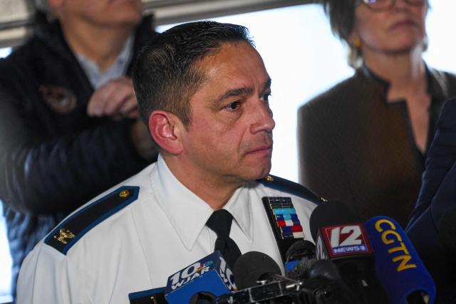 Colonel Oscar L. Perez, chief of police at the Providence Police Department speaks during a press conference near the campus of Brown University in Providence, Rhode Island on December 14, 2025. Hundreds of police officers hunted Sunday for a gunman who killed two people and wounded nine others at Brown University, plunging the eastern US campus into lockdown. (Photo by Bing Guan / AFP)
