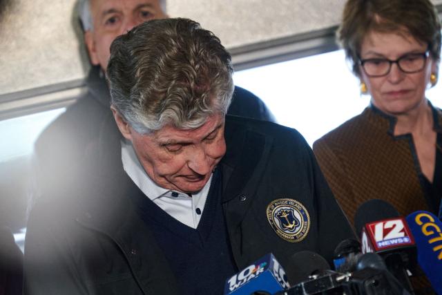 Daniel McKee, Governor from Rhode Island, prepares to speak during a press conference near the campus of Brown University in Providence, Rhode Island on December 14, 2025. Hundreds of police officers hunted Sunday for a gunman who killed two people and wounded nine others at Brown University, plunging the eastern US campus into lockdown. (Photo by Bing Guan / AFP)