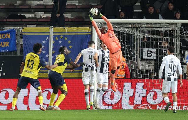 Royal Charleroi SC's Ivorian goalkeeper #30 Mohamed Kone catches the ball during the Belgian Pro League football match between Sporting Charleroi and Royale Union Saint-Gilloise, in Charleroi on December 14, 2025. (Photo by VIRGINIE LEFOUR / Belga / AFP) / Belgium OUT
