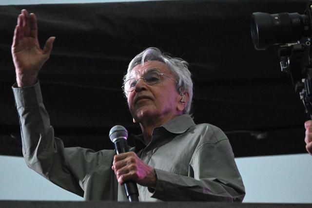 Brazilian artist Caetano Veloso performs during a protest calling for no amnesty for coup attempt in the case against former Brazilian president Jair Bolsonaro at Copacabana beach in Rio de Janeiro, Brazil, on December 14, 2025. (Photo by MAURO PIMENTEL / AFP)