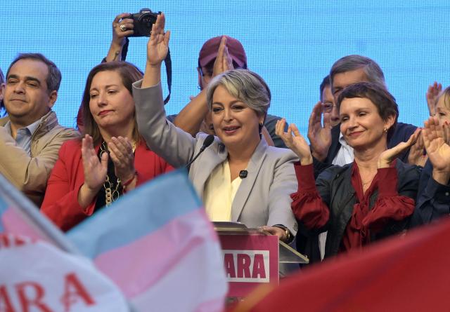 Chile's presidential candidate Jeannette Jara, of the Unidad por Chile coalition, gives a speech after conceding defeat in the presidential runoff election in Santiago on December 14, 2025. Chilean voters elected Jose Antonio Kast, the most right-wing president in 35 years of democracy, with a thumping 58 percent of votes and his rival Jeannette Jara conceding defeat, according to official results on December 14, 2025. (Photo by Rodrigo ARANGUA / AFP)