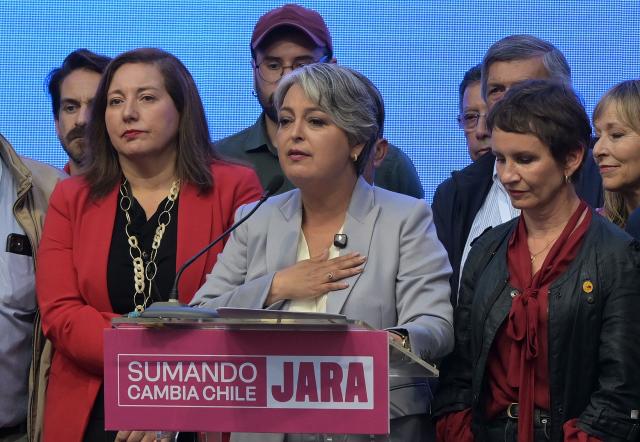 Chile's presidential candidate Jeannette Jara, of the Unidad por Chile coalition, gives a speech after conceding defeat in the presidential runoff election in Santiago on December 14, 2025. Chilean voters elected Jose Antonio Kast, the most right-wing president in 35 years of democracy, with a thumping 58 percent of votes and his rival Jeannette Jara conceding defeat, according to official results on December 14, 2025. (Photo by Rodrigo ARANGUA / AFP)