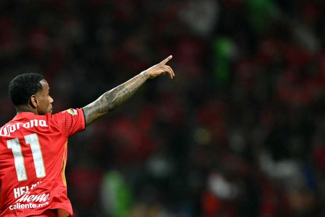 Toluca's Brazilian midfielder #11 Helinho celebrates scoring his team's first goal during the Liga MX Apertura final second leg football match between Toluca and Tigres at the Nemesio Diez stadium in Toluca, Mexico on December 14, 2025. (Photo by Yuri CORTEZ / AFP)