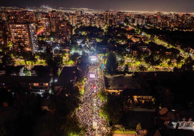 Aerial view of supporters of Chile's presidential candidate Jose Antonio Kast, of the Partido Republicano party, as he delivers a speech after the results of the presidential runoff election in Santiago on December 14, 2025. Chilean voters elected Jose Antonio Kast, the most right-wing president in 35 years of democracy, with a thumping 58 percent of votes and his rival Jeannette Jara conceding defeat, according to official results on December 14, 2025. (Photo by Eitan ABRAMOVICH / AFP)