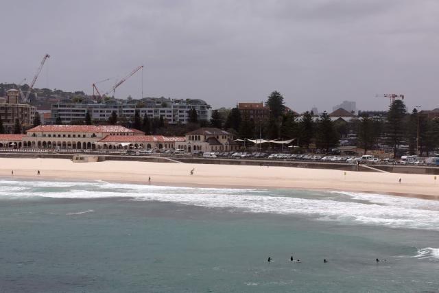 A view of the scene at the Bondi Pavillion in the aftermath of the Bondi Beach shootings in Sydney on December 15, 2025. A father-and-son team toting long-barrelled guns shot and killed 15 people including a 10-year-old girl at Sydney's Bondi Beach on December 14, with authorities labelling it an antisemitic terrorist attack on a Jewish festival. (Photo by DAVID GRAY / AFP)