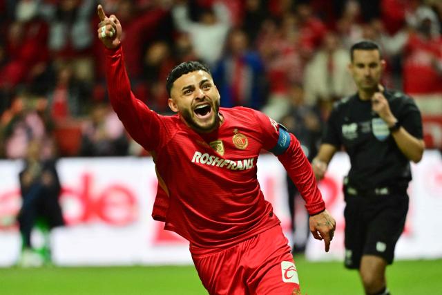 Toluca's forward #09 Alexis Vega celebrates after scoring against Tigres' Argentine goalkeeper #01 Nahuel Guzman (out of frame) during the penalty shootout of the Liga MX Apertura final second leg football match between Toluca and Tigres at the Nemesio Diez stadium in Toluca, Mexico on December 14, 2025. (Photo by Mario Vazquez / AFP)