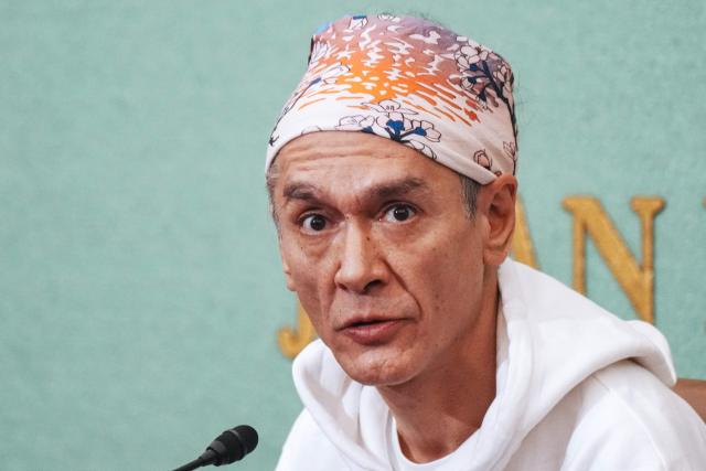 Kim Aris, son of Myanmar's deposed democratic leader Aung San Suu Kyi, speaks during a press conference at the Japan National Press Club in Tokyo on December 15, 2025. (Photo by Kazuhiro NOGI / AFP)