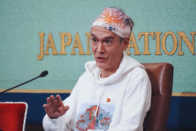 Kim Aris, son of Myanmar's deposed democratic leader Aung San Suu Kyi, speaks during a press conference at the Japan National Press Club in Tokyo on December 15, 2025. (Photo by Kazuhiro NOGI / AFP)