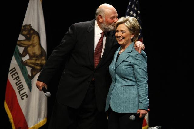 (FILES) Democratic presidential hopeful Senator Hillary Rodham Clinton gets a kiss from actor Rob Reiner at a fundraising event at the Wilshire Theater in Los Angeles, California on April 3, 2008. US director Rob Reiner and his wife Michele Reiner were found dead at their southern California mansion, CNN and NBC reported on December 14, 2025. Los Angeles police said in a media conference on Sunday evening they would not yet publicly confirm the identities of the two people found dead at the residence of the "When Harry Met Sally" director, and were not interviewing any suspects. (Photo by Robyn BECK / AFP)