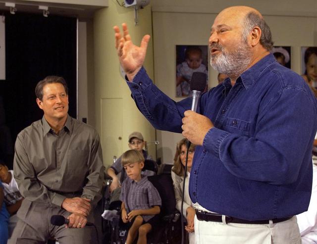 (FILES) US Vice President and Democratic presidential candidate Al Gore (L) listens to US actor and director Rob Reiner while participating in a children's health care forum at University Medical Center in Cleveland, Ohio, on August 13, 2000. US director Rob Reiner and his wife Michelle Reiner were found dead at their southern California mansion, CNN and NBC reported on December 14, 2025. Los Angeles police said in a media conference on Sunday evening they would not yet publicly confirm the identities of the two people found dead at the residence of the "When Harry Met Sally" director, and were not interviewing any suspects. (Photo by LUKE FRAZZA / AFP)