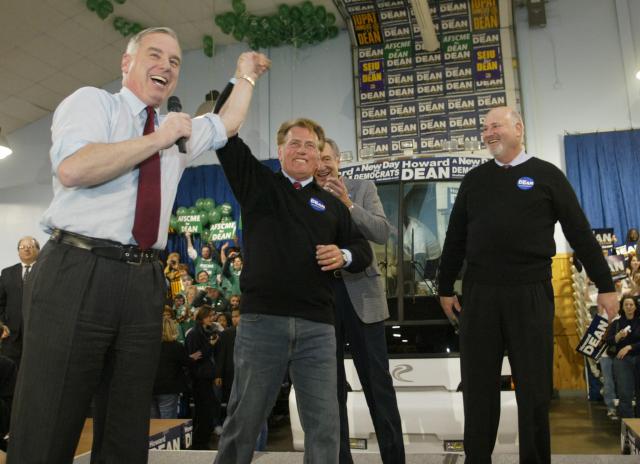 (FILES) Democratic Presidential candidate Governor Howard Dean (L) is greeted by actor Martin Sheen (C) and actor/director Rob Reiner (R) as he campaigns at the Iowa State Fairgrounds in Des Moines, Iowa, on January 14, 2004. US director Rob Reiner and his wife Michelle Reiner were found dead at their southern California mansion, CNN and NBC reported on December 14, 2025. Los Angeles police said in a media conference on Sunday evening they would not yet publicly confirm the identities of the two people found dead at the residence of the "When Harry Met Sally" director, and were not interviewing any suspects. (Photo by TIMOTHY A. CLARY / AFP)