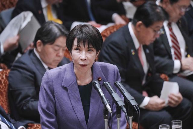 Japan's Prime Minister Sanae Takaichi answers questions during a session of the House of Councillors budget committee in the National Diet in Tokyo on December 15, 2025. (Photo by Kazuhiro NOGI / AFP)