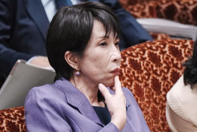 Japan's Prime Minister Sanae Takaichi listens to questions during a session of the House of Councillors budget committee in the National Diet in Tokyo on December 15, 2025. (Photo by Kazuhiro NOGI / AFP)