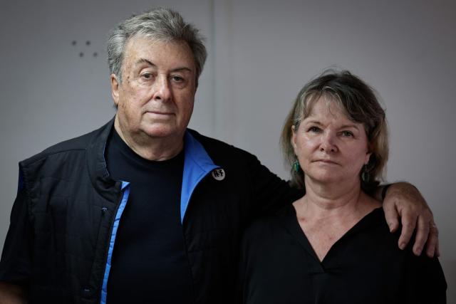 (FILES) French sports journalist Christophe Gleizes' mother Sylvie Godard and his stepfather Francis Godard pose during a photo session at the International press freedom watchdog Reporters sans frontieres (RSF- Reporters Without Borders) headquarters in Paris, on August 27, 2025. The mother of French sports journalist Christophe Gleizes, who was sentenced on appeal in early December in Algeria to seven years in prison, has submitted a request for a presidential pardon to Algeria's President Abdelmadjid Tebboune, according to a letter dated December 10, 2025 and seen by AFP on December 15, 2025. (Photo by STEPHANE DE SAKUTIN / AFP)