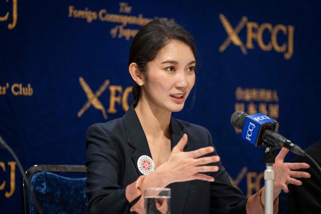 Journalist and Director Shiori Ito speaks during a press conference following a press screening event of the film "Black Box Diaries" in Tokyo on December 15, 2025. (Photo by Yuichi YAMAZAKI / AFP)