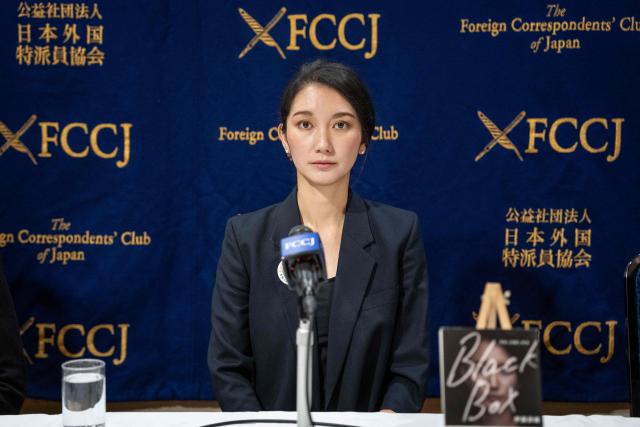 Journalist and Director Shiori Ito poses ahead of a press conference following a press screening event of the film "Black Box Diaries" in Tokyo on December 15, 2025. (Photo by Yuichi YAMAZAKI / AFP)