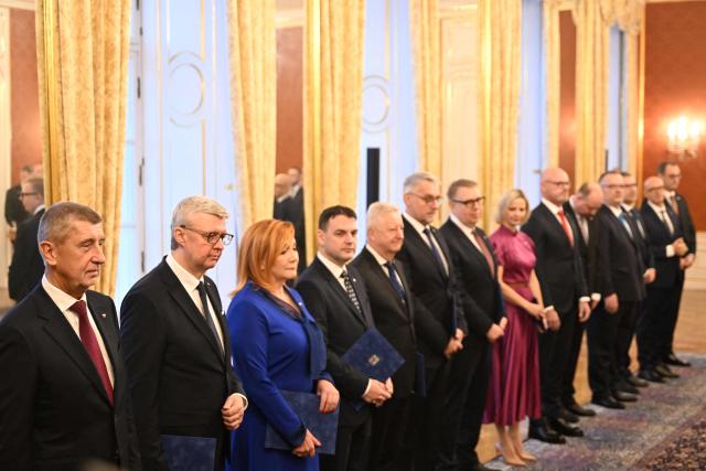 Czech Prime Minister Andrej Babis (L) and the newly appointed members of the Czech government are seen on December 15, 2025 at the Hradcany Castle in Prague, Czech Republic. (Photo by Michal Cizek / AFP)