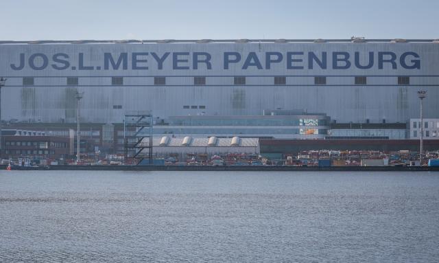(FILES) A company building of the Meyer shipyards in Papenburg, northwestern Germany is pictured on September 16, 2024. The partially state-owned Meyer Werft shipyard in Lower Saxony has received a billion-euro order from the Swiss shipping company MSC. The two companies have just signed a corresponding contract “that secures the future of Meyer Werft,” said German Economy Minister Katherina Reiche on December 15, 2025. According to the ministry, it involves four to six ships with an order value of ten billion euros. (Photo by Focke STRANGMANN / AFP)