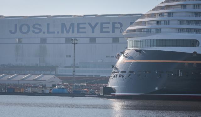 (FILES) The new Disney Treasure cruise ship of Disney Cruise line is moored at the Meyer shipyards in Papenburg, northwestern Germany on September 16, 2024. The partially state-owned Meyer Werft shipyard in Lower Saxony has received a billion-euro order from the Swiss shipping company MSC. The two companies have just signed a corresponding contract “that secures the future of Meyer Werft,” said German Economy Minister Katherina Reiche on December 15, 2025. According to the ministry, it involves four to six ships with an order value of ten billion euros. (Photo by Focke STRANGMANN / AFP)