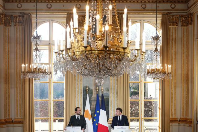 France's President Emmanuel Macron (R) and Cyprus' President Nikos Christodoulides give a press conference following their meeting at the Elysee Palace in Paris, on December 15, 2025. (Photo by Dimitar DILKOFF / AFP)