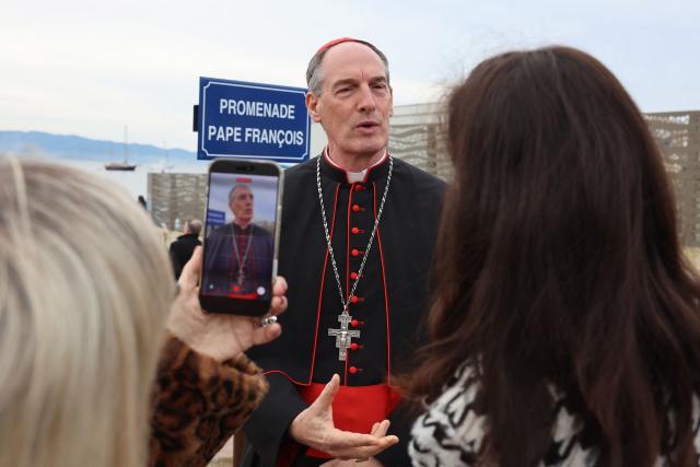Cardinal François Bustillo answers journalists after the inauguration of a street sign on December 15, 2025 in commemoration of the visit of Pope Francois in Ajaccio on the Corsican island of Corsica one year ago. (Photo by Pascal POCHARD-CASABIANCA / AFP)