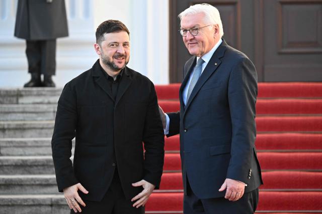 German President Frank-Walter Steinmeier (R) welcomes Ukraine's President Volodymyr Zelensky at the presidential Bellevue Palace in Berlin, Germany, on December 15, 2025. Ukrainian President Volodymyr Zelensky was set to push on with talks in Berlin with US President Donald Trump's envoys on how to end the grinding war with Russia. (Photo by RALF HIRSCHBERGER / AFP)