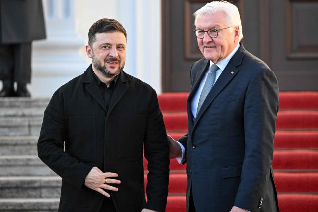 German President Frank-Walter Steinmeier (R) welcomes Ukraine's President Volodymyr Zelensky at the presidential Bellevue Palace in Berlin, Germany, on December 15, 2025. Ukrainian President Volodymyr Zelensky was set to push on with talks in Berlin with US President Donald Trump's envoys on how to end the grinding war with Russia. (Photo by RALF HIRSCHBERGER / AFP)