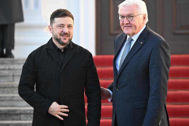 German President Frank-Walter Steinmeier (R) welcomes Ukraine's President Volodymyr Zelensky at the presidential Bellevue Palace in Berlin, Germany, on December 15, 2025. Ukrainian President Volodymyr Zelensky was set to push on with talks in Berlin with US President Donald Trump's envoys on how to end the grinding war with Russia. (Photo by RALF HIRSCHBERGER / AFP)
