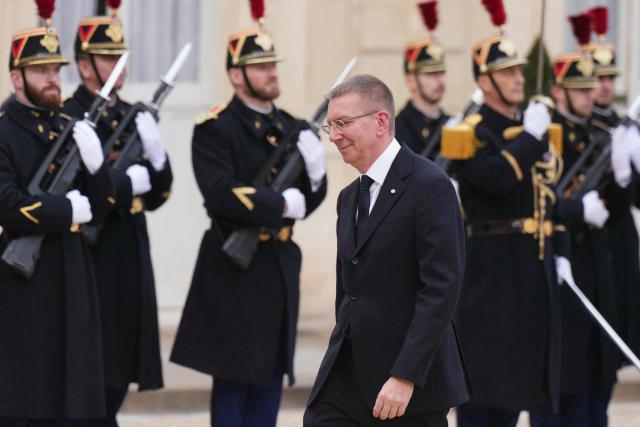 Latvia's president Edgars Rinkevics arrives for a meeting with French president at the Elysee Palace in Paris, on December 15, 2025. (Photo by Dimitar DILKOFF / AFP)