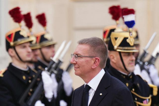 Latvia's president Edgars Rinkevics arrives for a meeting with French president at the Elysee Palace in Paris, on December 15, 2025. (Photo by Dimitar DILKOFF / AFP)