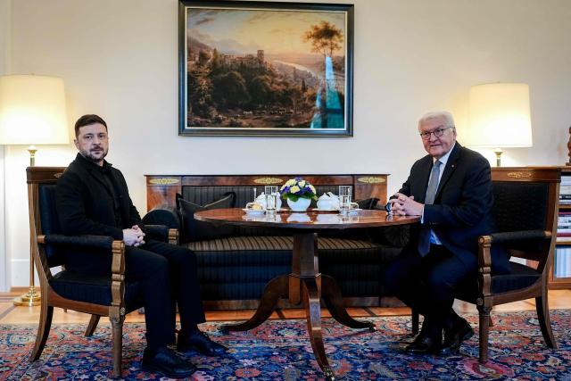 German President Frank-Walter Steinmeier (R) poses with Ukraine's President Volodymyr Zelensky ahead talks at the presidential Bellevue Palace in Berlin, Germany, on December 15, 2025. Ukrainian President Volodymyr Zelensky was set to push on with talks in Berlin with US President Donald Trump's envoys on how to end the grinding war with Russia. (Photo by Kay Nietfeld / POOL / AFP)