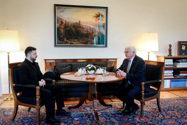 German President Frank-Walter Steinmeier (R) meets with Ukraine's President Volodymyr Zelensky  at the presidential Bellevue Palace in Berlin, Germany, on December 15, 2025. Ukrainian President Volodymyr Zelensky was set to push on with talks in Berlin with US President Donald Trump's envoys on how to end the grinding war with Russia. (Photo by Kay Nietfeld / POOL / AFP)