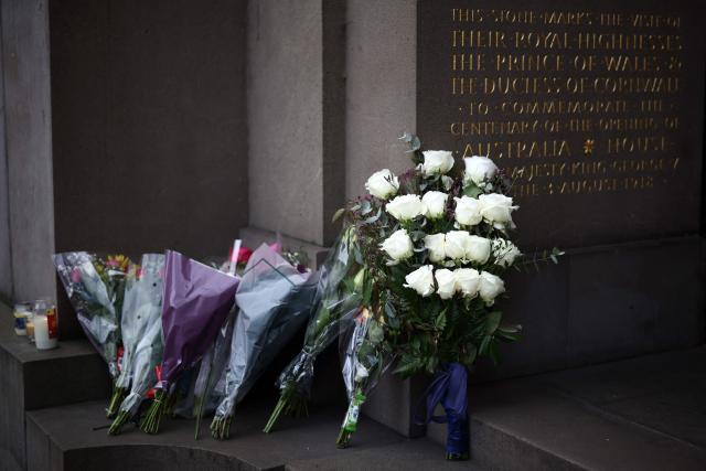 Candles and flowers are pictured, left on the steps of The Australian High Commission in London on December 15, 2025, to remember the victims of the Bondi Beach attack. A father-and-son team toting long-barrelled guns shot and killed 15 people including a 10-year-old girl at Sydney's Bondi Beach, authorities said on December 15, labelling it an antisemitic terrorist attack on a Jewish festival. (Photo by Henry NICHOLLS / AFP)