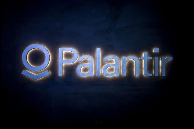 (FILES) This photograph hsow the logo of the US big data analytics software company Palantir Technologies during the World Economic Forum (WEF) annual meeting in Davos, on January 23, 2025. The American company Palantir, regularly criticised in Europe due to concerns about data sovereignty, officially announced on December 15, 2025, the renewal of its contract with the French General Directorate for Internal Security (DGSI) for a further three years. (Photo by Fabrice COFFRINI / AFP)