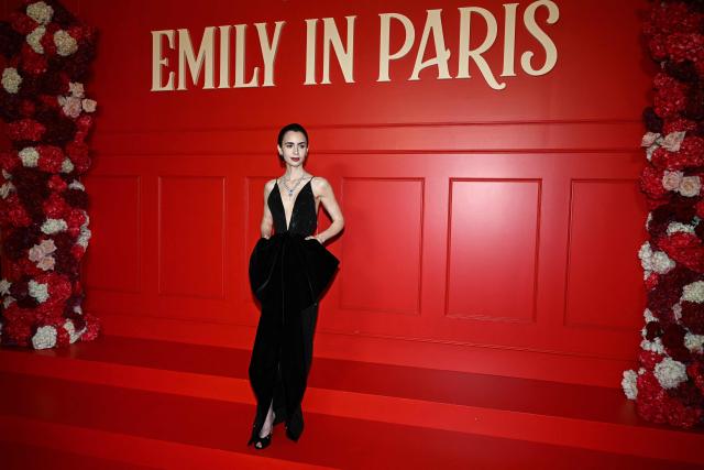US actress Lily Collins poses during the avant-premiere of TV serie "Emily in Paris" season 5, at the Grand Rex, in Paris on December 15, 2025. (Photo by Blanca CRUZ / AFP)