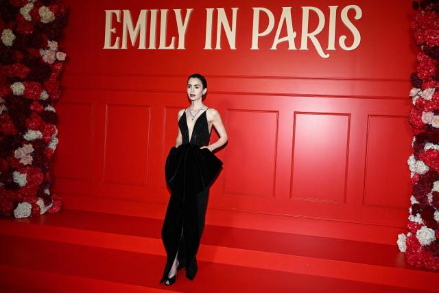 US actress Lily Collins poses during the avant-premiere of TV serie "Emily in Paris" season 5, at the Grand Rex, in Paris on December 15, 2025. (Photo by Blanca CRUZ / AFP)