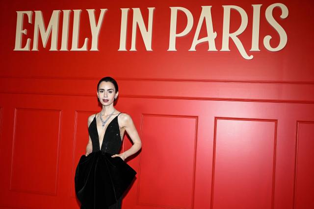US actress Lily Collins poses during the avant-premiere of TV serie "Emily in Paris" season 5, at the Grand Rex, in Paris on December 15, 2025. (Photo by Blanca CRUZ / AFP)