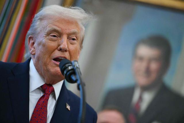 US President Donald Trump speaks during a Mexican Border Defense Medal presentation in the Oval Office of the White House in Washington, DC, on December 15, 2025. (Photo by ANDREW CABALLERO-REYNOLDS / AFP)