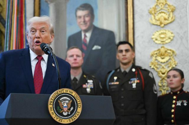 US President Donald Trump speaks during a Mexican Border Defense Medal presentation in the Oval Office of the White House in Washington, DC, on December 15, 2025. (Photo by ANDREW CABALLERO-REYNOLDS / AFP)