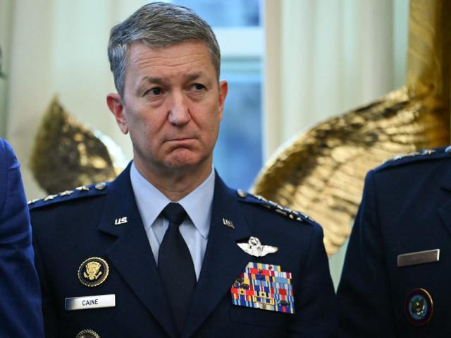 US Chairman of the Joint Chiefs of Staff Gen. Dan Caine attends a Mexican Border Defense Medal presentation in the Oval Office of the White House in Washington, DC, on December 15, 2025. (Photo by ANDREW CABALLERO-REYNOLDS / AFP)
